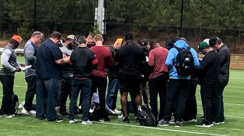 Here are NFL scouts exchanging information on the official times from the Kennesaw State Pro Day drills at The Perch on Wednesday, April 11, 2020. (By D. Orlando Ledbetter/dledbetter@ajc.com)