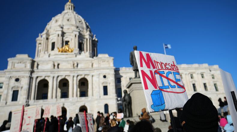 Protesters gather in front of the Minnesota State Capitol in response to the death of Renee Good, who was fatally shot by an ICE officer last week, Wednesday, Jan. 14, 2026, in St. Paul, Minn. (AP Photo/Abbie Parr)