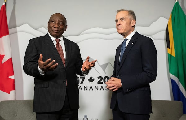 Canadian Prime Minister Mark Carney, right, meets with President of the Republic of South Africa Cyril Ramaphosa, left, as the G7 gets under way in Calgary, Alberta, Sunday, June 15, 2025. (Jason Franson/The Canadian Press via AP)