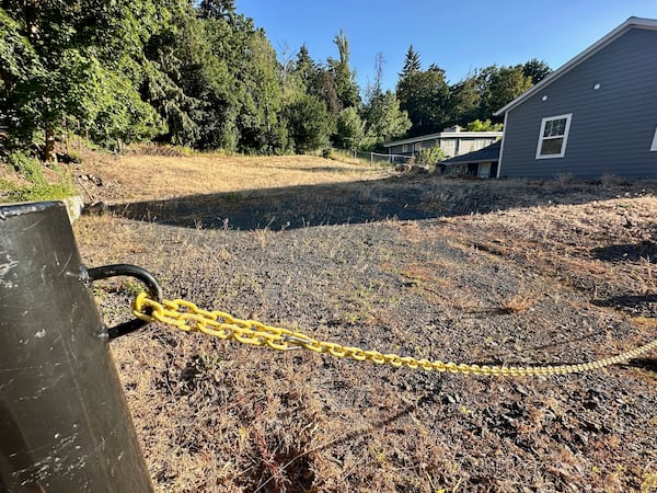 An empty lot stands on Monday, June 30, 2025, at the site where four University of Idaho students were killed in November 2022 inside a house in Moscow, Idaho. (AP Photo/Manuel Valdes)
