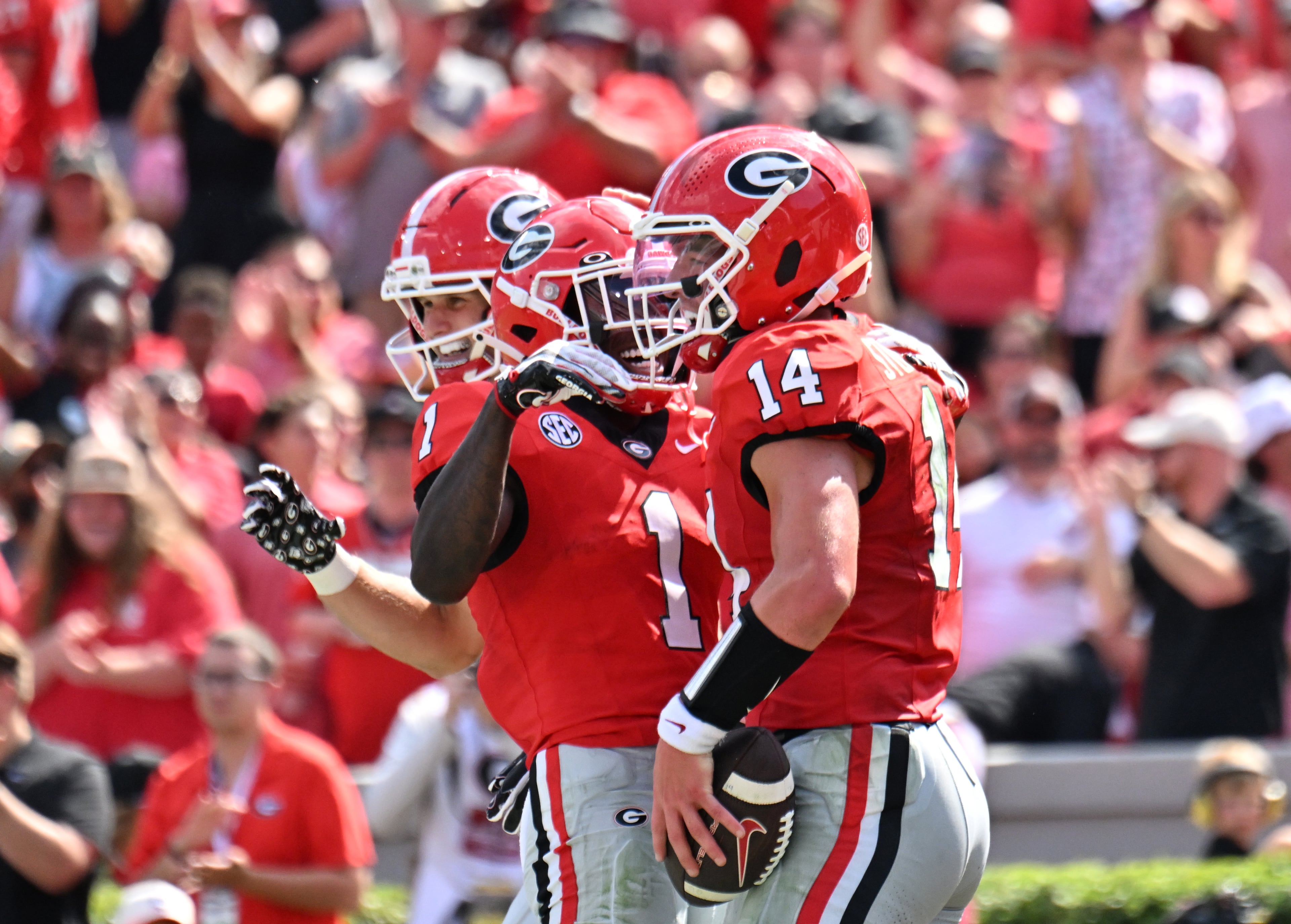 Georgia quarterback Gunner Stockton (14) celebrates with teammates after scoring a touchdown during the first half in an NCAA football game at Sanford Stadium, Saturday, August 30, 2025, in Athens. (Hyosub Shin / AJC)
