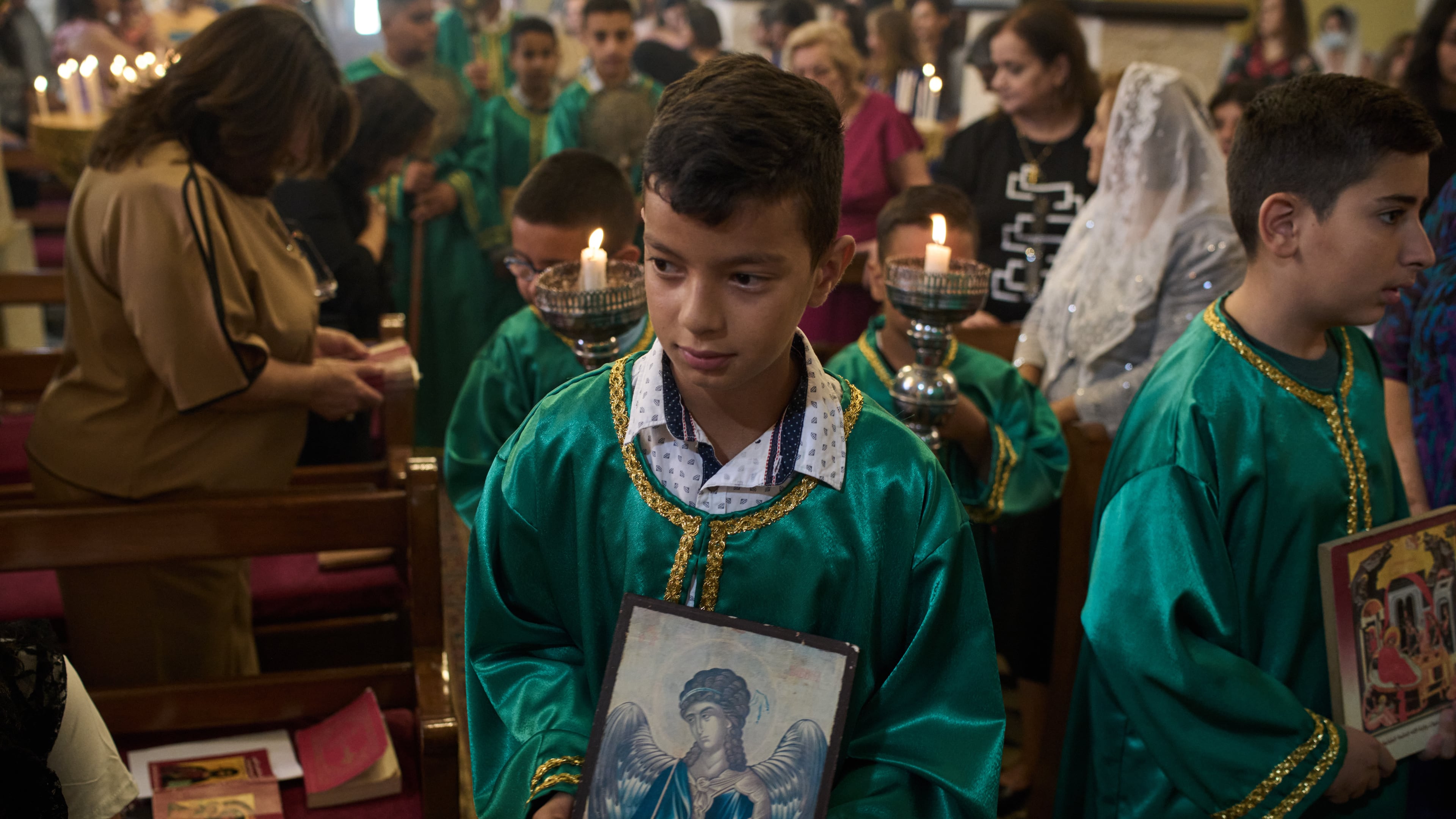 Palestinian children attend morning Mass at the Greek Orthodox Church of St. George in the West Bank village of Taybeh, Sept. 28, 2025. (AP Photo/Leo Correa)