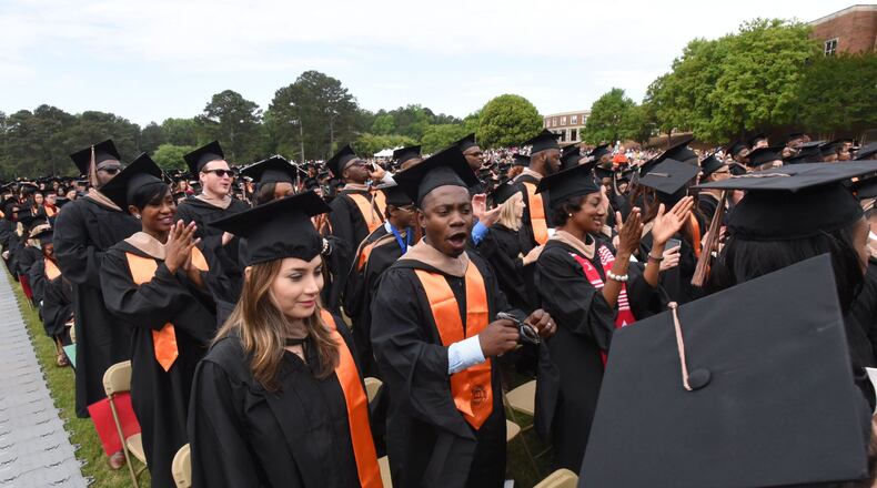 Mercer University students during commencement ceremonies. AJC FILE PHOTO