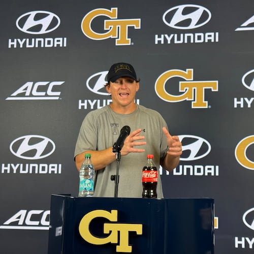 Georgia Tech offensive line coach Allen Mogridge speaks during a news conference after the Yellow Jackets’ seventh day of fall camp on Tuesday, Aug. 11, 2026, in Atlanta. Mogridge has worked to maintain a bond with offensive lineman Josh Petty. (Fisher Isbell/AJC)