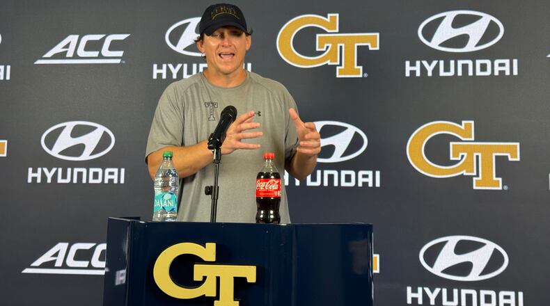 Georgia Tech offensive line coach Allen Mogridge speaks during a news conference after the Yellow Jackets’ seventh day of fall camp on Tuesday, Aug. 11, 2026, in Atlanta. Mogridge has worked to maintain a bond with offensive lineman Josh Petty. (Fisher Isbell/AJC)