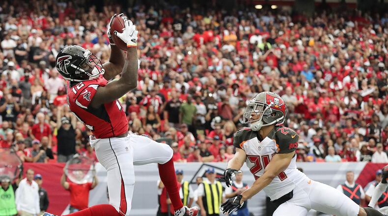 September 11, 2016 ATLANTA: Falcons wide receiver Mohamed Sanu catches a touchdown pass past Buccaneers cornerback Brent Grimes for a 10-3 lead during the first quarter in an NFL football game on Sunday, Sept. 11, 2016, in Atlanta. Curtis Compton /ccompton@ajc.com