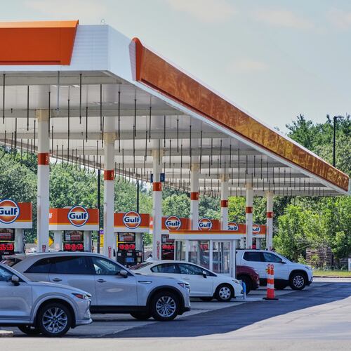 FILE - Cars line up at the pumps of a Gulf Oil station on the Massachusetts Turnpike near Boston, Sunday, July 19, 2026. (AP Photo/Gene J. Puskar, File)