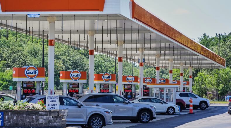 FILE - Cars line up at the pumps of a Gulf Oil station on the Massachusetts Turnpike near Boston, Sunday, July 19, 2026. (AP Photo/Gene J. Puskar, File)