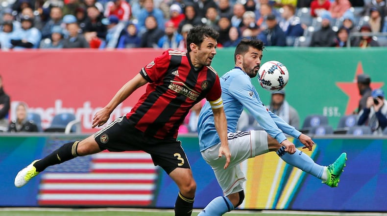 Atlanta United defender Michael Parkhurst (3) and New York City FC forward David Villa (7), of Spain, go for the ball during the first half of a Major League Soccer game Sunday, May 7, 2017, in New York. (AP Photo/Kathy Willens)