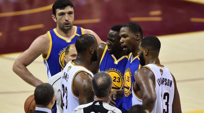 Golden State Warriors forward Kevin Durant (35) and Cleveland Cavaliers forward LeBron James (23) argue during the third quarter in game four of the Finals for the 2017 NBA Playoffs at Quicken Loans Arena.