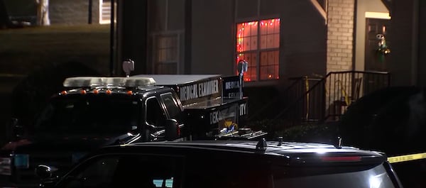 Police are investigating after five people were killed in a suspected murder-suicide at an apartment complex in DeKalb County. Christmas lights from the unit could be seen shining into the parking lot Saturday night. (Courtesy Channel 2 Action News)
