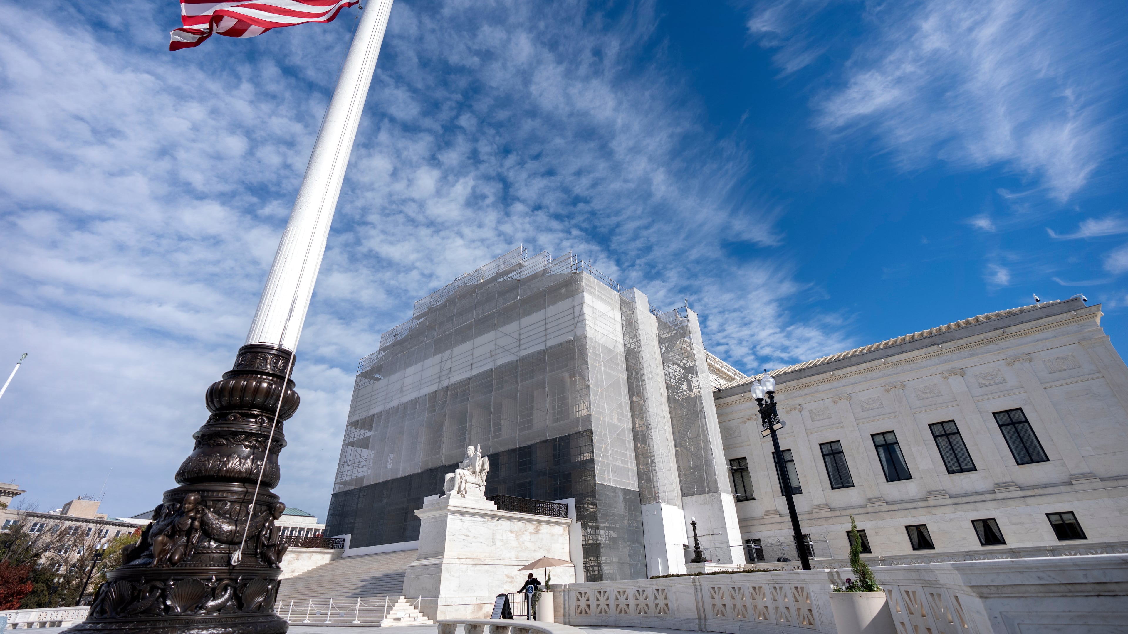 FILE -An American flag flies at half-staff outside the Supreme Court Nov. 5, 2025, in Washington. (AP Photo/Mark Schiefelbein, File)