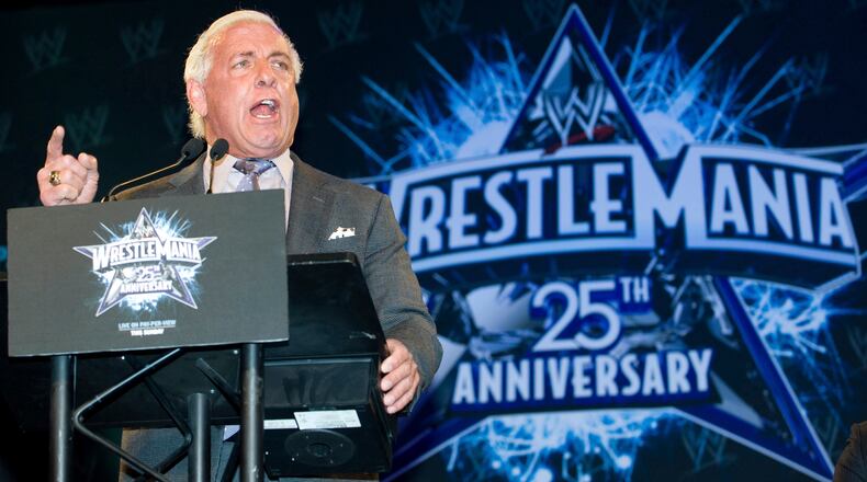FILE - In this March 31, 2009, file photo, wrestler Ric Flair attends the 25th Anniversary of WrestleMania press conference at the Hard Rock Cafe in New York. Flair, whose "Wooooooo!" call during promos and matches became one of the most imitated catchphrases in sports, thought he would die. Alive, and with a new lease on life, Flair tells The Associated Press he's done drinking and vows to clean up his act with whatever time he has left. (AP Photo/Charles Sykes, File)