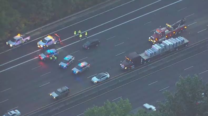 A deadly crash blocked several lanes of I-285 West in Dunwoody on Monday morning.