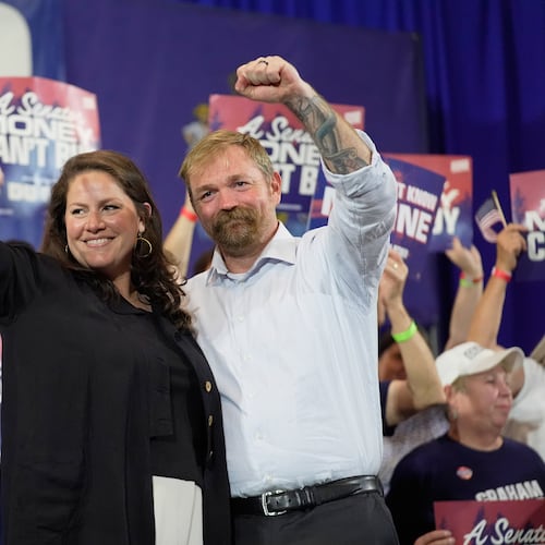 Democratic U.S. Senate candidate Graham Platner, right, and his wife Amy Gertner gesture to supporters during a primary election night watch party Tuesday, June 9, 2026, in Blue Hill, Maine. (AP Photo/Robert F. Bukaty)