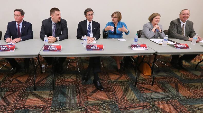 April 12, 2017, Marietta: Candidates Matt Campbell (from left), Royden Roy Daniels, Exton Howard, Gus Makris, Kay Kirkpatrick, Christine Triebsch, and Bob Wiskind participate in a debate for the open state Senate seat that was held by Judson Hill at the East Cobb Library on Wednesday in Marietta. Curtis Compton/ccompton@ajc.com