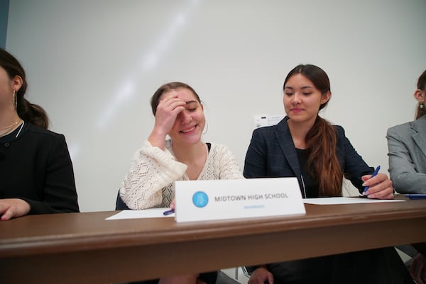 Midtown High School Ethics Bowl teammates Lizzie Lyman, left, and Sloane Crisler prepare for the quarterfinal round at the National High School Ethics Bowl in Chapel Hill, N.C., on Sunday, April 13, 2025. (AP Photo/Allen G. Breed)