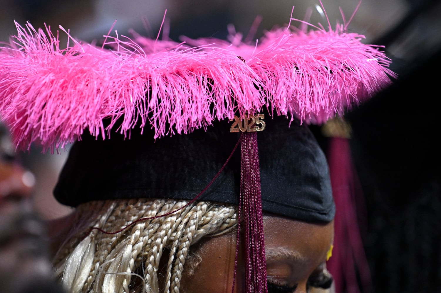 A graduating students wears a colorful cap during Clark Atlanta University’s 2025 commencement ceremony Sunday, May 18, 2025 at Georgia State’s Convocation Center. (Daniel Varnado/For the Atlanta Journal-Constitution)