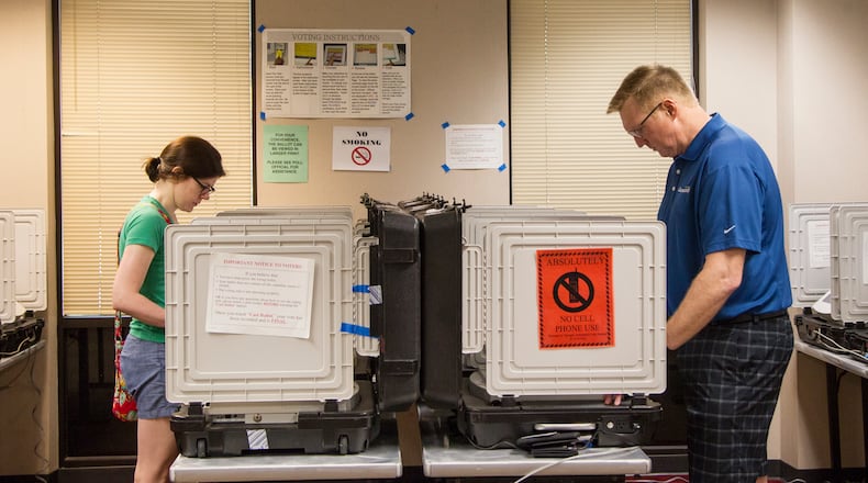 People cast their vote during Saturday early voting at the Dunwoody Public Library in Dunwoody, Georgia, on Saturday, May 12, 2018. (REANN HUBER/REANN.HUBER@AJC.COM)