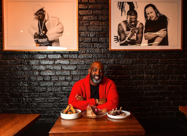 Sim Walker, owner of Apt 4B, in the restaurant's dining room in 2021 (Chris Hunt for the AJC)