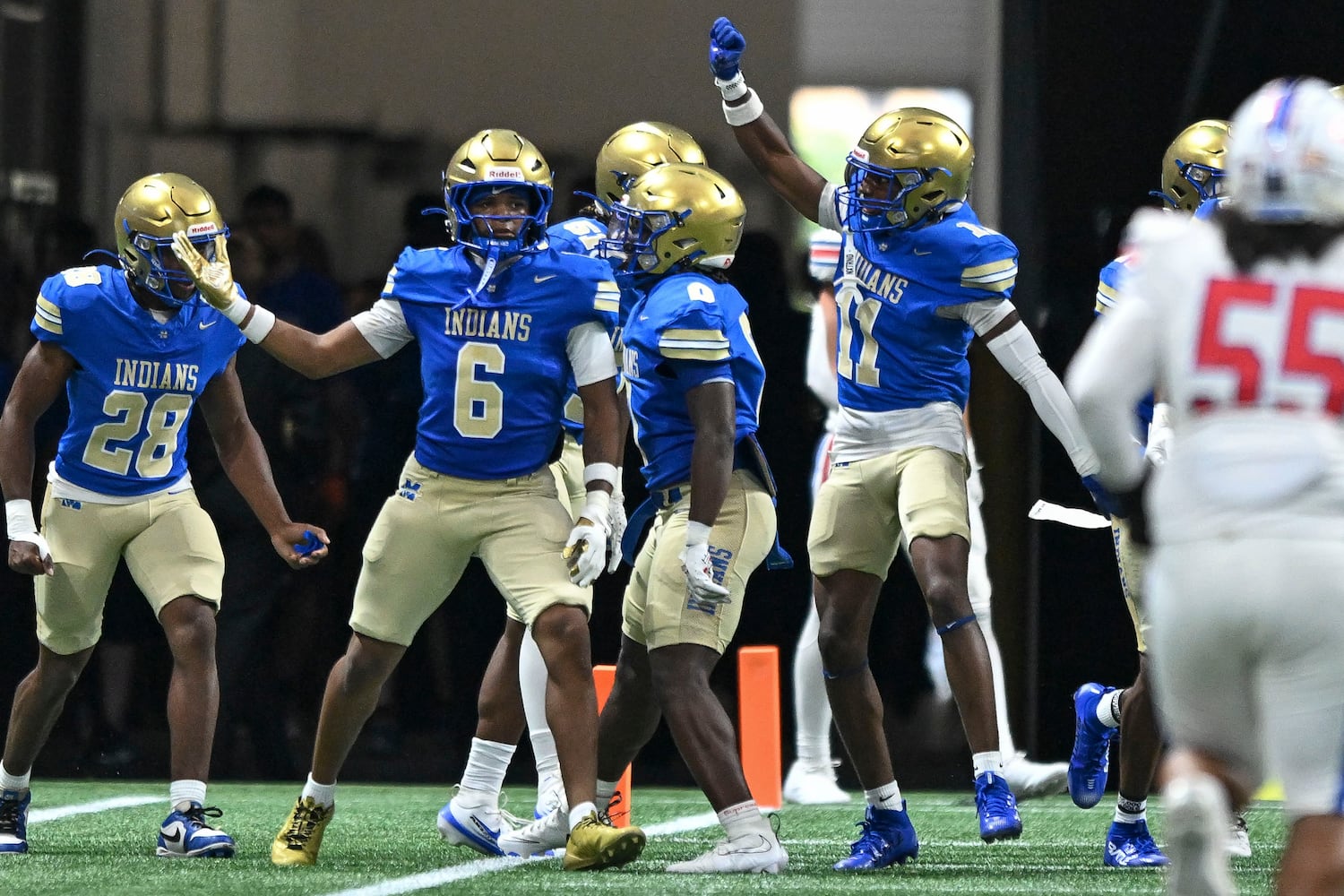 McEachern’s Casey Barner (6) and Indian teammates gesture towards the Walton student section after Barner scores during the first half of the Corky Kell Classic football game Saturday, August 16, 2025 at the Mercedes-Benz Stadium. (Daniel Varnado/For the Atlanta Journal-Constitution)