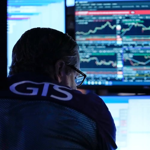 A trader works on the floor of the New York Stock Exchange, Thursday, July 30, 2026, in New York. (AP Photo/Yuki Iwamura)