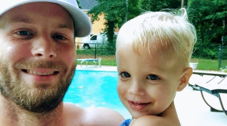 Steven Rahn, pictured with his son, Peyton, was an assistant football coach at East Paulding High School.