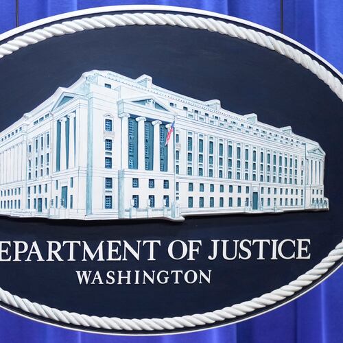 The Department of Justice seal is seen at the Justice Department, Wednesday, Nov. 19, 2025, in Washington. (AP Photo/Mark Schiefelbein)
