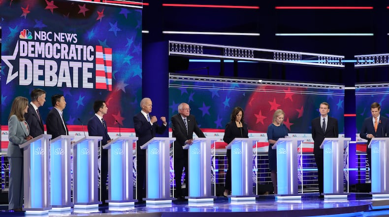 MIAMI, FLORIDA - JUNE 27: Democratic presidential candidates (L-R) Marianne Williamson, former Colorado governor John Hickenlooper, former tech executive Andrew Yang, South Bend, Indiana Mayor Pete Buttigieg, former Vice President Joe Biden, Sen. Bernie Sanders (I-VT), Sen. Kamala Harris (D-CA), Sen. Kirsten Gillibrand (D-NY), Sen. Michael Bennet (D-CO) and Rep. Eric Swalwell (D-CA) take part in the second night of the first Democratic presidential debate on June 27, 2019 in Miami, Florida. A field of 20 Democratic presidential candidates was split into two groups of 10 for the first debate of the 2020 election, taking place over two nights at Knight Concert Hall of the Adrienne Arsht Center for the Performing Arts of Miami-Dade County, hosted by NBC News, MSNBC, and Telemundo. (Photo by Drew Angerer/Getty Images)