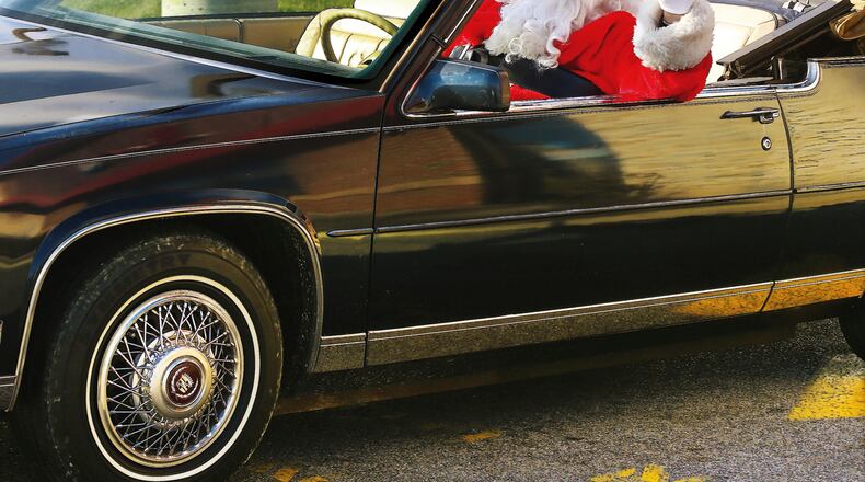 There’s no indication that the Santa on Marietta Square will be in an antique Cadillac convertible, but this picture was too fun not to use.