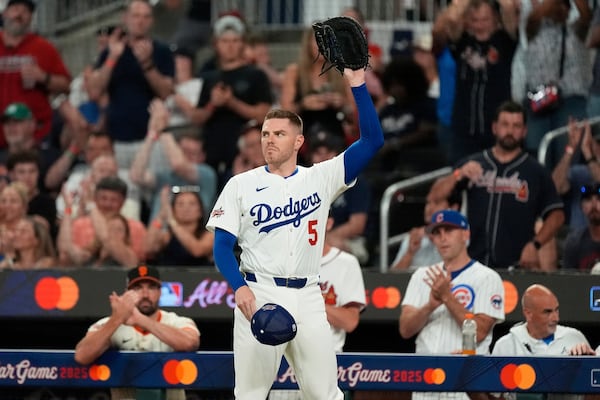 Los Angeles Dodgers Freddie Freeman waves to the crowd after leaving the game during third inning at the MLB baseball All-Star game between the American League and National League, Tuesday, July 15, 2025, in Atlanta. (AP Photo/Mike Stewart)