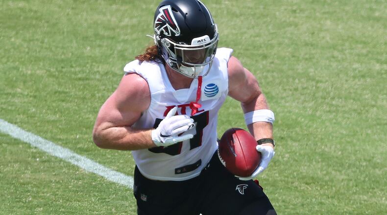 Falcons tight end Hayden Hurst makes a sidelines reception during organize team activities (OTAs) Tuesday, May 25, 2021, at the team training facility in Flowery Branch. (Curtis Compton / Curtis.Compton@ajc.com)