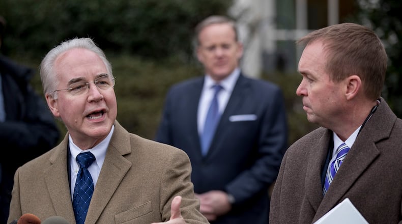 Health and Human Services Secretary Tom Price, left, speaking outside of the White House last month. (AP Photo/Andrew Harnik)