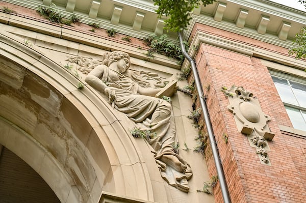 A marble statue on the archway of the historic building at 208 Bull St. in Savannah, Ga. (Sarah Peacock for The Atlanta Journal-Constitution)