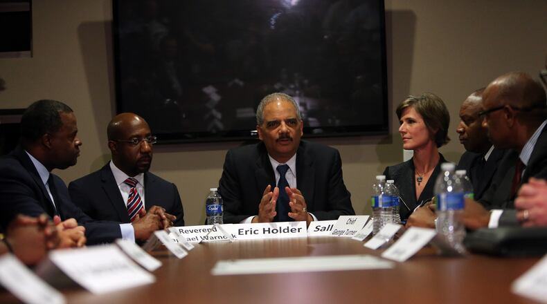 Attorney General Eric Holder sits beside Sally Quillian Yates at a December event in Atlanta. Then-Attorney General Eric Holder sits beside Sally Quillian Yates at a December event in Atlanta. (AJC/Ben Gray)