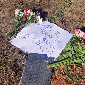 A makeshift memorial to Savannah schoolteacher Linda Davis stands in the median of Whitefield Avenue, near where she was killed Feb. 16, 2026, in an automobile accident. The wreck involved a Guatemalan man who was fleeing federal immigration agents and ran a red light, colliding with Davis' car. (Adam Van Brimmer/AJC)