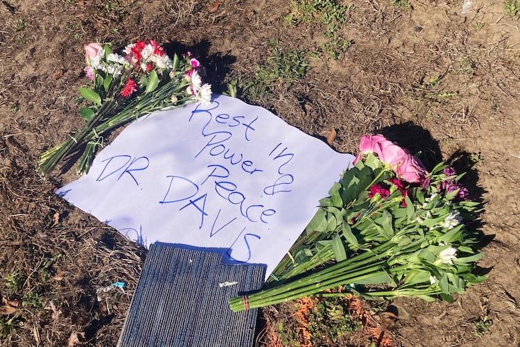 A makeshift memorial to Savannah schoolteacher Linda Davis was erected in the median of Whitefield Avenue, near where she was killed Monday in an automobile accident. The wreck involved a Guatemalan man who was fleeing federal immigration agents and ran a red light, colliding with Davis' car. (Adam Van Brimmer/AJC)