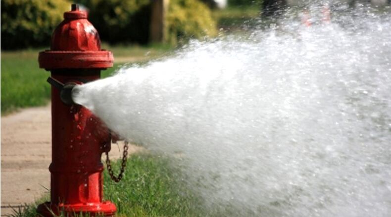 The Woodstock Fire Department will test and flow city fire hydrants in the coming weeks, action that could cause discolored water for some residents. AJC FILE