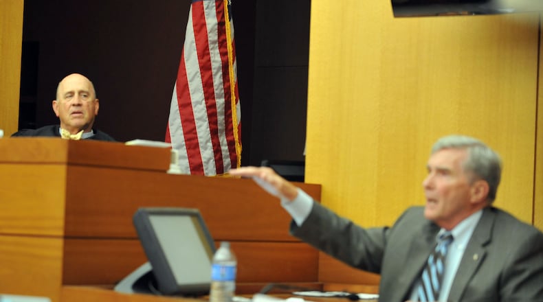 Fulton County Superior Court Judge Jerry Baxter listens to former GA attorney general Mike Bowers as he answers questions on the stand for a second day.
