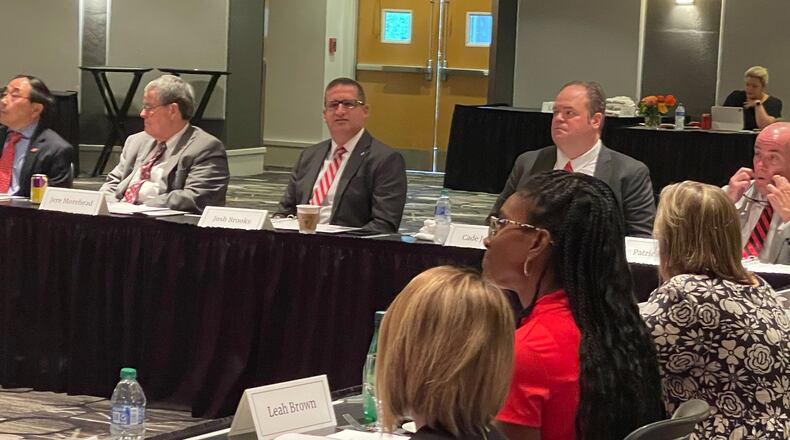 Georgia Athletic Director Josh Brooks watches one of several presentations at the Bulldogs fall semester athletic association board of directors meeting in the Mahler Room of the Georgia Center for Continuing Education in Athens, Georgia, on Sept. 22, 2023. (Photo by Chip Towers/ctowers@ajc.com)