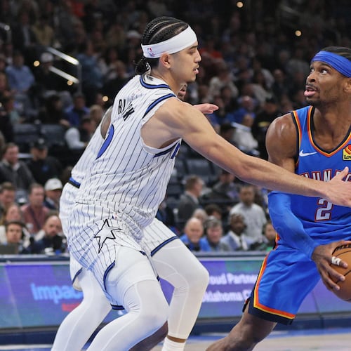 Oklahoma City Thunder guard Shai Gilgeous-Alexander (2) looks for an outlet against Orlando Magic guard Anthony Black, left, during the second half of an NBA basketball game, Tuesday, Feb. 3, 2026, in Oklahoma City. (AP Photo/Nate Billings)