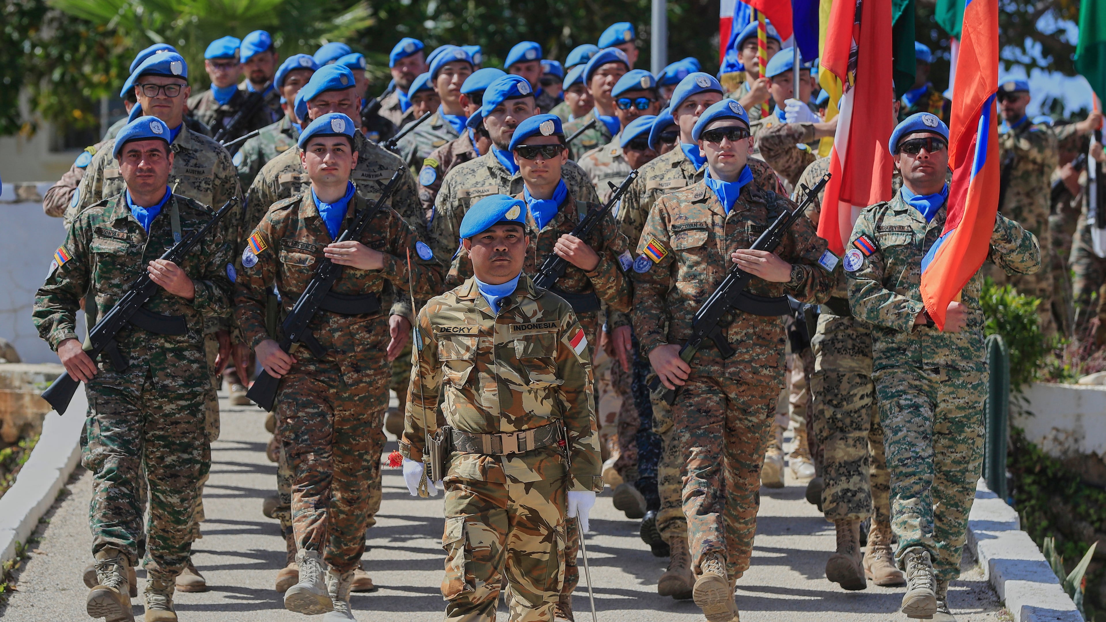 FILE - U.N. peacekeepers from different national contingents march during a ceremony to mark the 47th anniversary of UNIFIL Establishment Day, at the United Nation Peacekeepers headquarters in the southern Lebanese town of Naqoura, Lebanon, March 19, 2025. (AP Photo/Mohammed Zaatari, File)