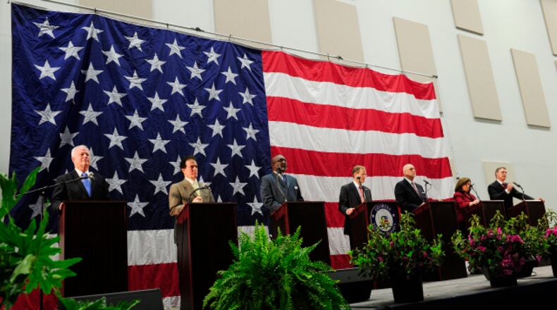 From left, U.S. Reps. Paul Broun and Phil Gingrey, Derrick Grayson, Rep. Jack Kingston, Arthur Gardner, Karen Handel, and David Perdue stand at their podiums near the end of a U.S. Senate debate of GOP candidates.