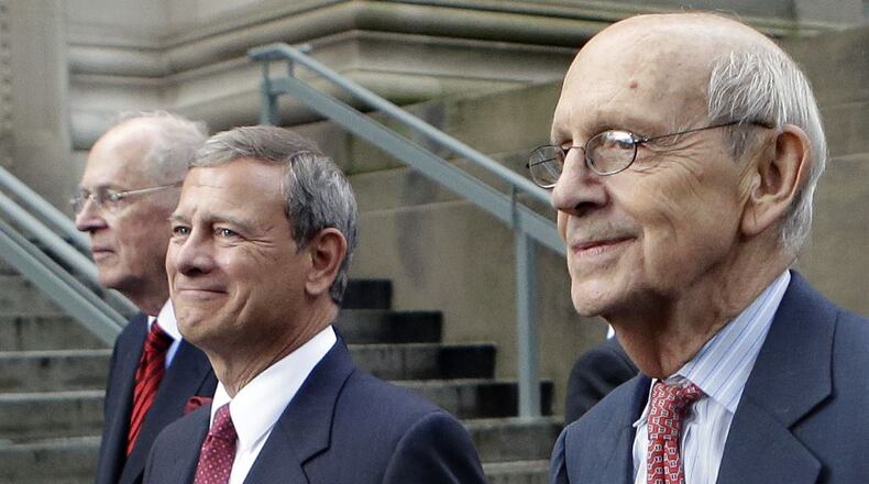 Supreme Court Justices Anthony Kennedy, left, and Stephen Breyer, right, walk with Chief Justice John Robert during a procession last week at Harvard Law School. (Steven Senne / Associated Press)