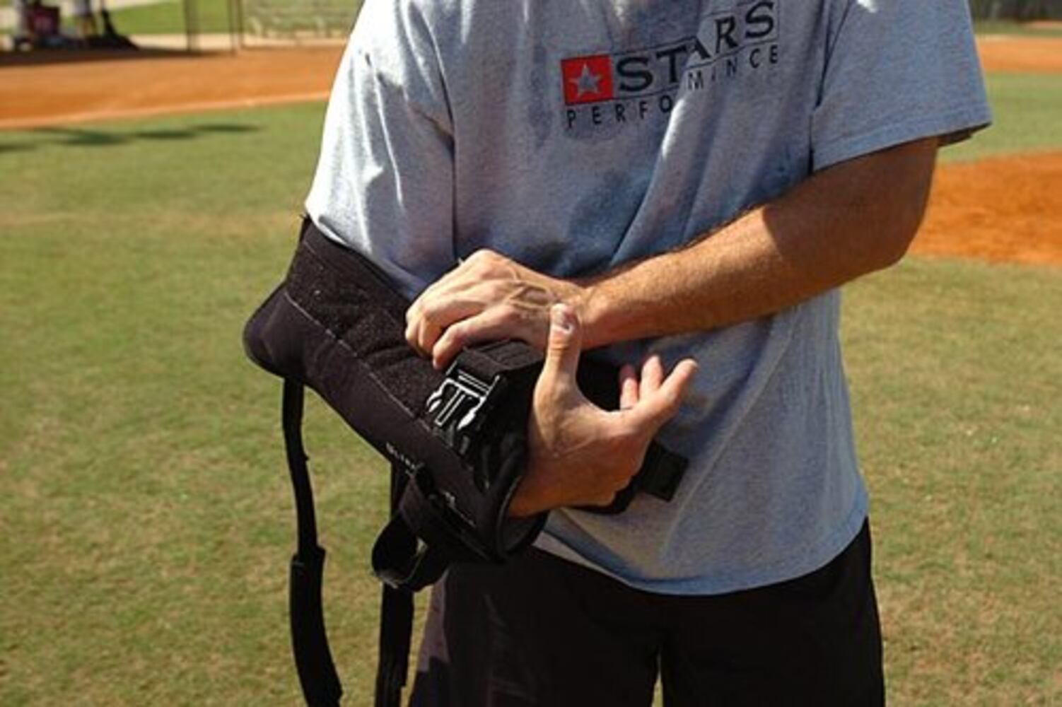 Smoltz coaches young fans at baseball camp