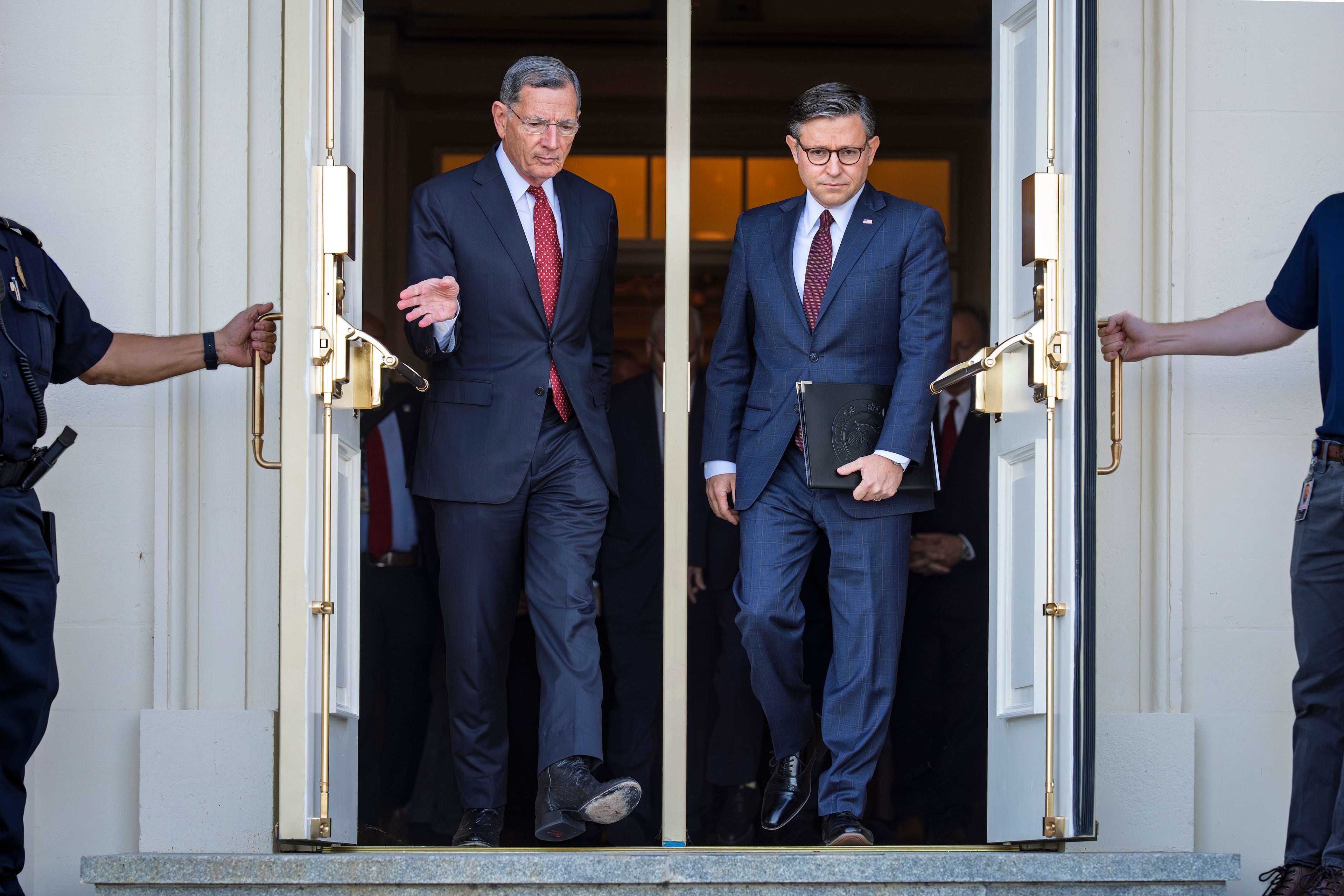 U.S. Sen. John Barrasso (left), R-Wyo. and House Speaker Mike Johnson headed to a news conference on the first day of the government shutdown last month. (J. Scott Applewhite/AP)