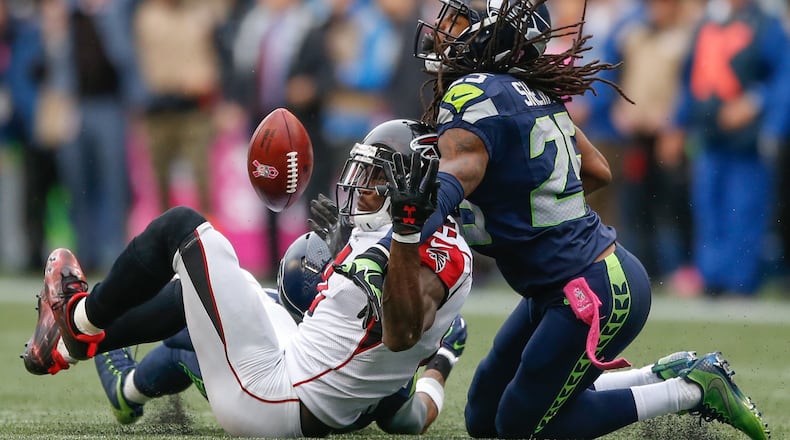 SEATTLE, WA - OCTOBER 16: Wide receiver Julio Jones #11 of the Atlanta Falcons can't make the catch on fourth down as cornerback Richard Sherman #25 of the Seattle Seahawks defends at CenturyLink Field on October 16, 2016 in Seattle, Washington. (Photo by Otto Greule Jr/Getty Images)