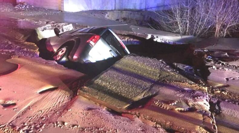 A sinkhole swallows an SUV in New Mexico.