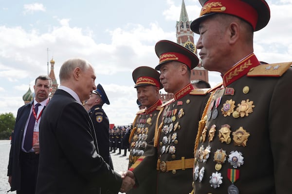 Russian President Vladimir Putin, left, speaks with North Korean officers after the Victory Day military parade in Moscow, Russia, Friday, May 9, 2025, during celebrations of the 80th anniversary of the Soviet Union's victory over Nazi Germany during the World War II. (Gavriil Grigorov, Sputnik, Kremlin Pool Photo via AP)