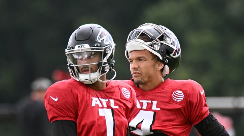 August 25 , 2022 Flowery Branch - Atlanta Falcons' quarterback Marcus Mariota (1) and Atlanta Falcons' quarterback Desmond Ridder (4) participate in Atlanta Falcons’s joint practice with Jacksonville Jaguars at the Falcons Practice Facility in Flowery Branch on Thursday, August 25, 2022. (Hyosub Shin / Hyosub.Shin@ajc.com)